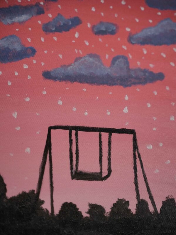 Swing under a pink sky