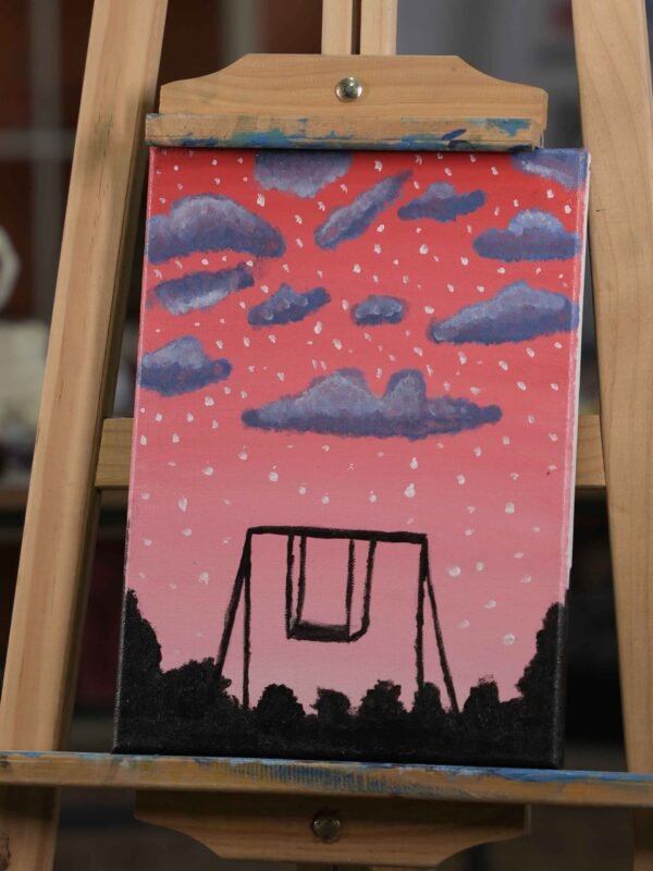 Swing under a pink sky